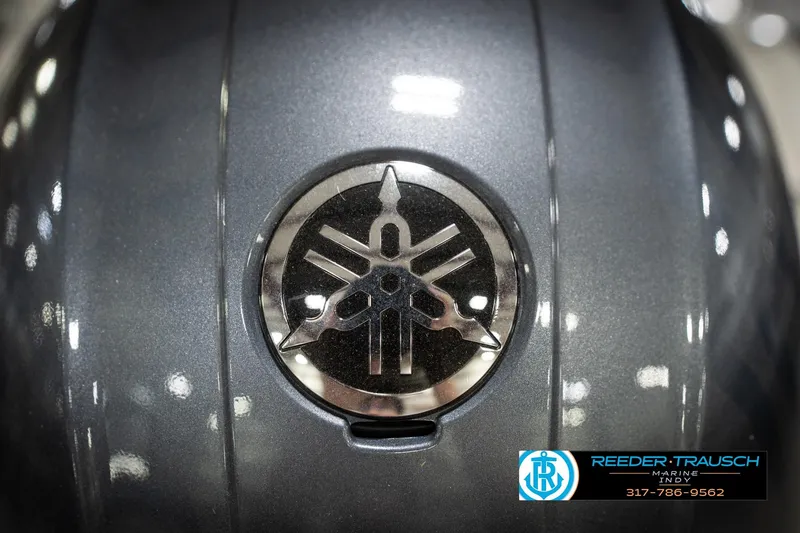 Slide: The Image of Gray Yamaha engine cover with logo, Reeder Trausch Marine contact details, Hurricane 235RD 2022 model. - 49