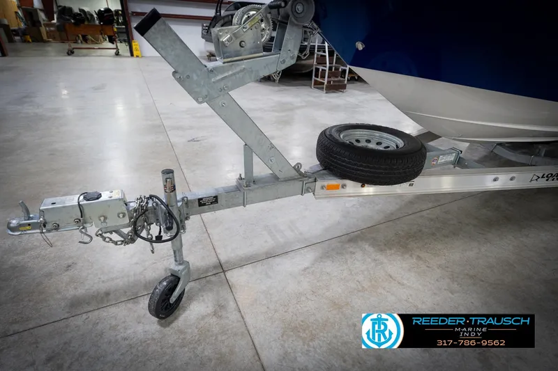 Slide: The Image of Trailer hitch of 2022 Hurricane 235RD boat in a showroom setting. - 54