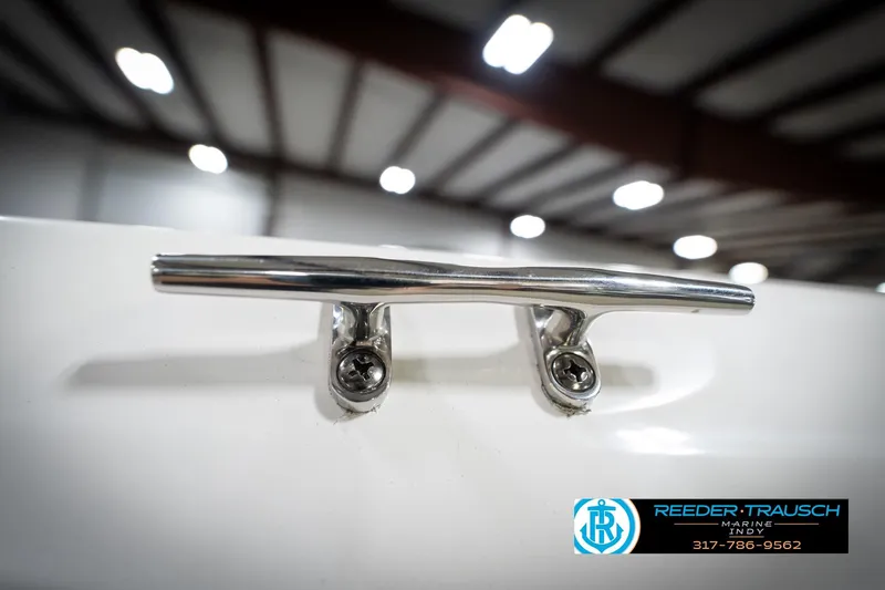 Slide: The Image of Close-up of a 2022 Hurricane 235RD boat cleat in a well-lit showroom. - 58