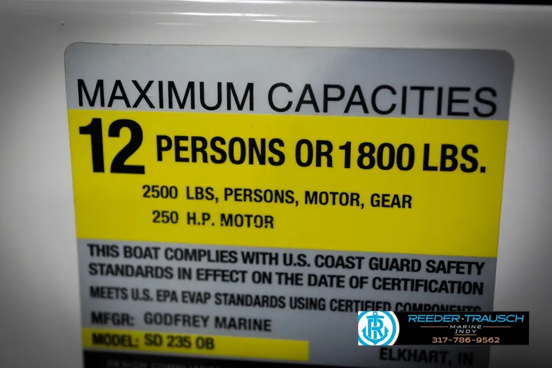 Slide: The Image of 2022 Hurricane 235RD boat capacity label: 12 persons or 1800 lbs, 2500 lbs total. - 59