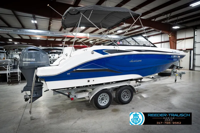 Slide: The Image of 2022 Hurricane 235RD boat with Yamaha engine on trailer in indoor showroom. - 7