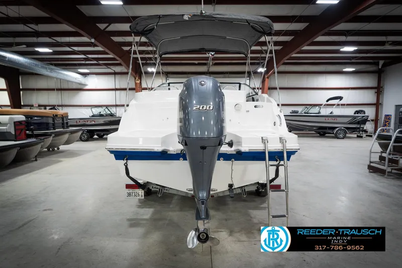 Slide: The Image of 2022 Hurricane 235RD boat with 200 HP engine in indoor showroom. - 8