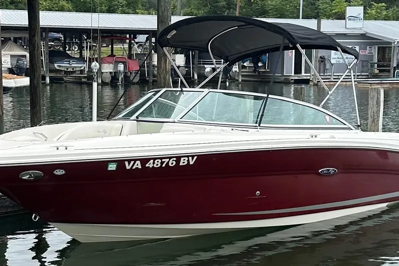 Slide: The Image of 2006 Sea Ray 220 Select boat docked at marina with canopy and registration number VA 4876 BV. - 3