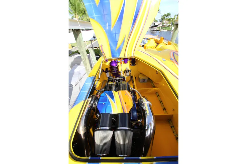 Slide: The Image of Yellow and blue 2007 MTI 40RP boat engine with vibrant design. - 16