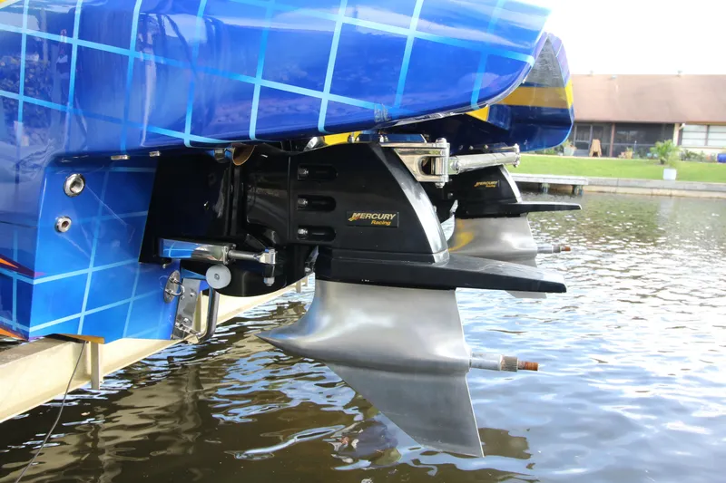 Slide: The Image of 2007 MTI 40RP boat with Mercury Racing engines, docked on water. - 20
