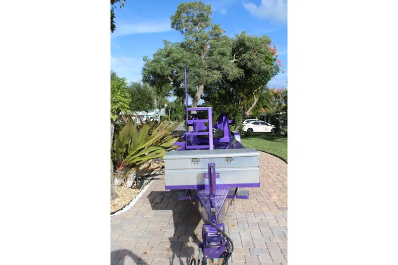 Slide: The Image of Purple MTI 40RP trailer, 2007 model, parked on a brick driveway with lush greenery. - 29