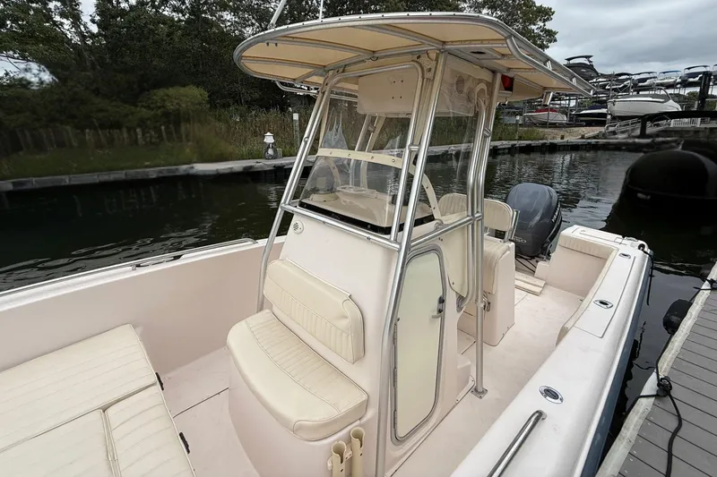 Slide: The Image of 2008 Grady-White Fisherman 222 boat docked, featuring center console and seating. - 13
