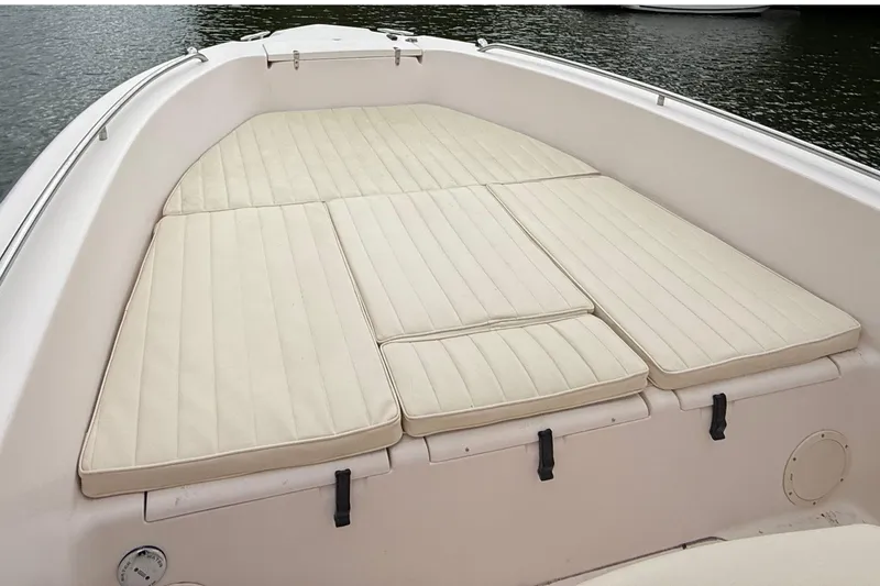 Slide: The Image of 2008 Grady-White Fisherman 222 boat with cushioned deck, on calm water. - 15