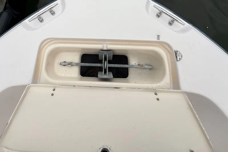 Slide: The Image of Anchor compartment of 2008 Grady-White Fisherman 222 boat, featuring a secured anchor. - 16