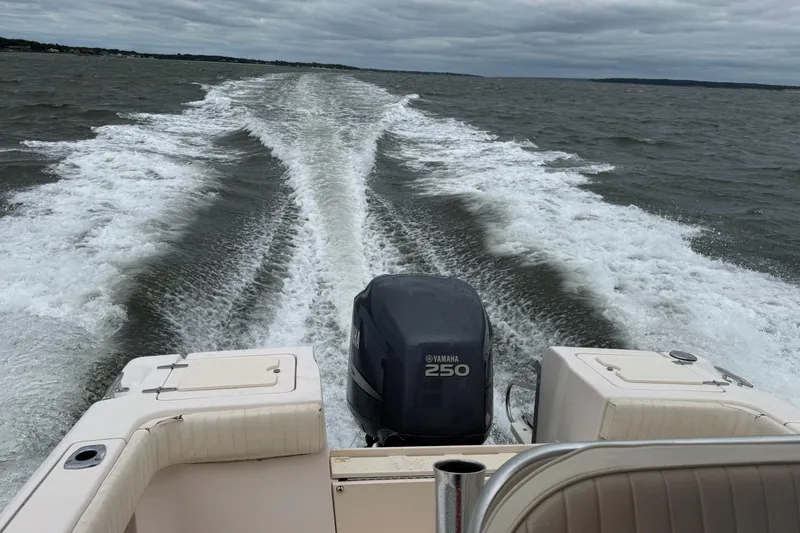 Slide: The Image of 2008 Grady-White Fisherman 222 boat cruising on open water, Yamaha 250 engine visible. - 17