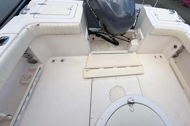 Slide: The Image of 2008 Grady-White Fisherman 222 boat interior with seating and motor view. - 5