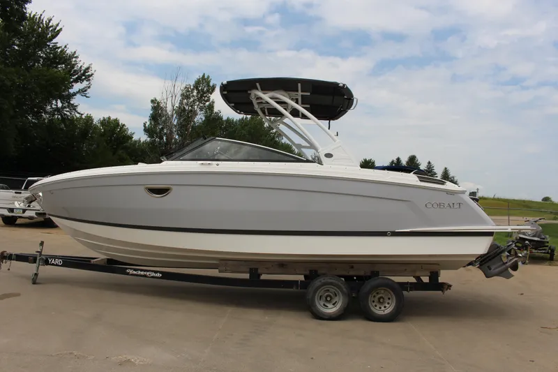 The Image of 2025 Cobalt R8 boat on trailer, parked outdoors, side view. - 1