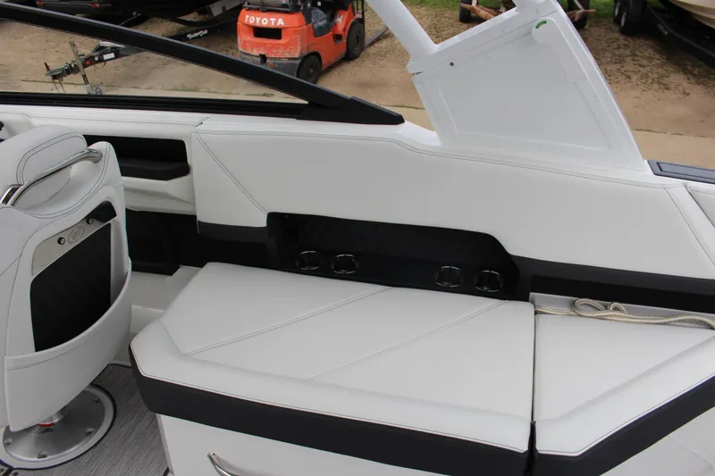 Slide: The Image of 2025 Cobalt R8 boat interior with white seating and modern design elements. - 16
