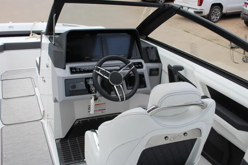 Slide: The Image of 2025 Cobalt R8 boat cockpit with modern steering and digital displays. - 17