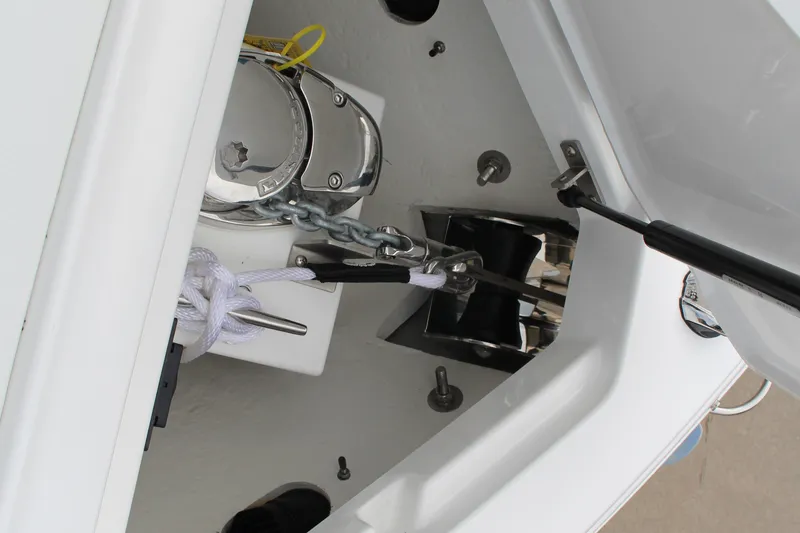 Slide: The Image of 2025 Cobalt R8 boat anchor compartment with chain and rope storage. - 21