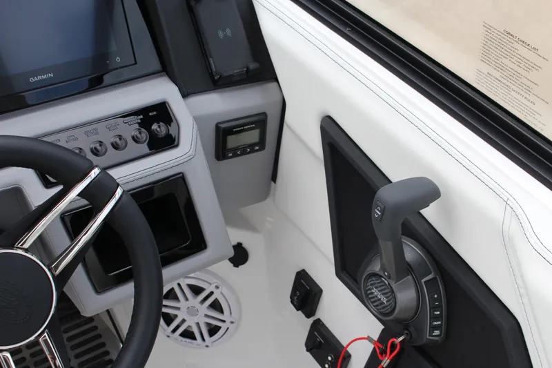Slide: The Image of Interior of 2025 Cobalt R8 boat with steering wheel and control panel. - 26
