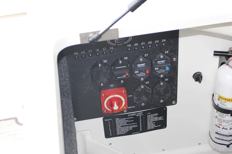 Slide: The Image of Control panel of a 2025 Cobalt R8 boat with fire extinguisher. - 29