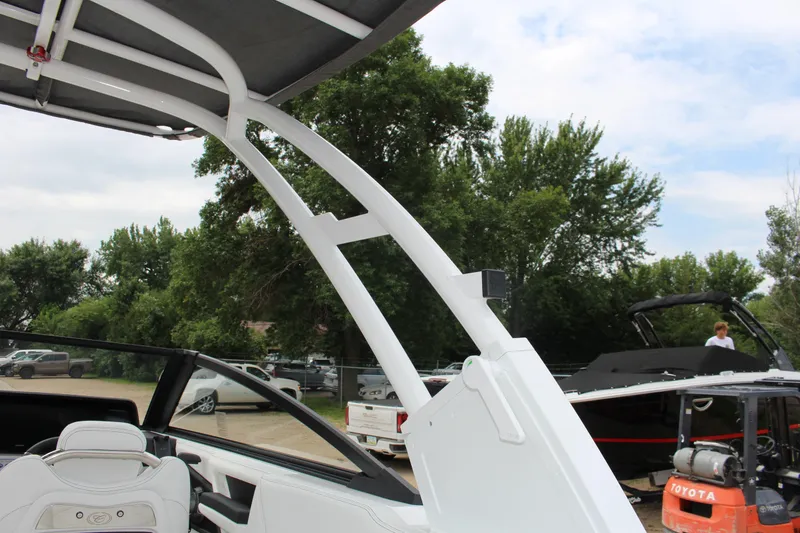 Slide: The Image of 2025 Cobalt R8 boat with sleek design and modern features, parked outdoors. - 33