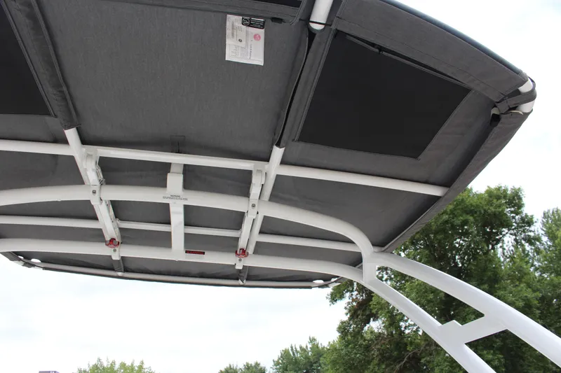 Slide: The Image of 2025 Cobalt R8 boat canopy with sturdy white frame and gray fabric. - 34
