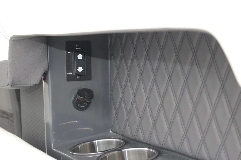 Slide: The Image of Interior detail of 2025 Cobalt R8 with quilted panel, control switch, and cup holders. - 36