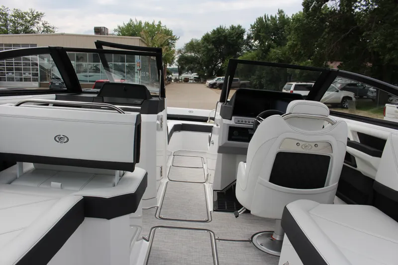 Slide: The Image of 2025 Cobalt R8 boat interior with luxurious white seating and modern dashboard. - 38