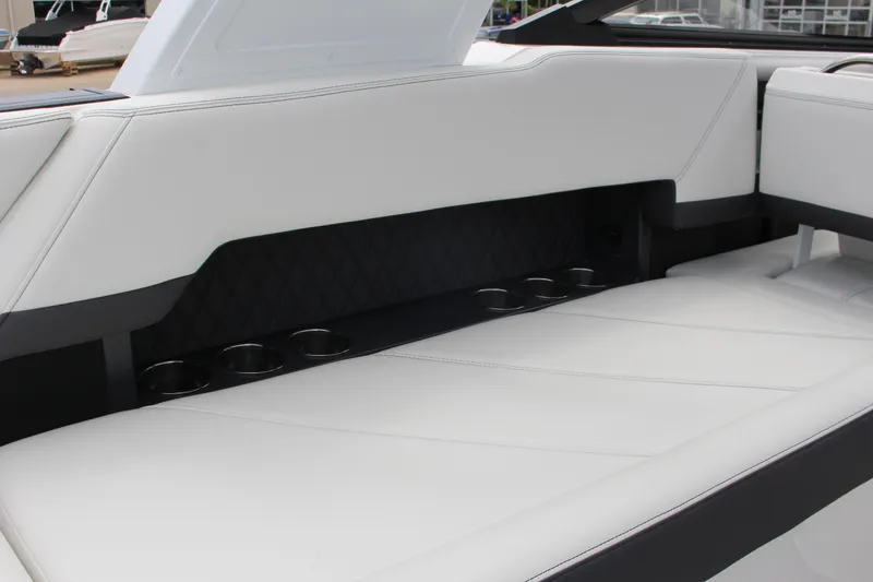 Slide: The Image of Luxurious white seating with cup holders in 2025 Cobalt R8 boat interior. - 41