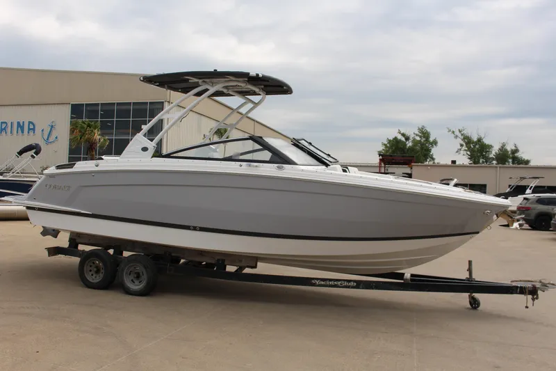 Slide: The Image of 2025 Cobalt R8 boat on trailer at marina, side view. - 5