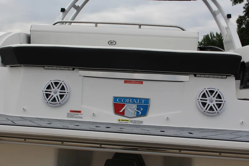 Slide: The Image of 2025 Cobalt R8 boat rear view with speakers and logo. - 9