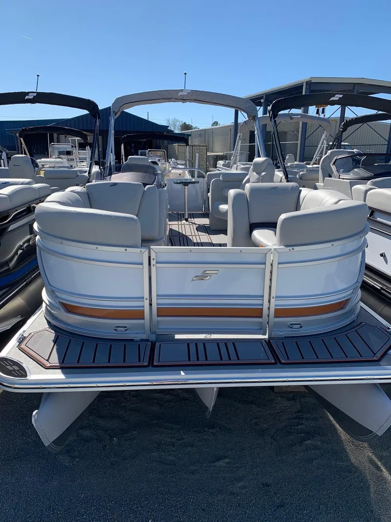 Slide: The Image of 2024 Starcraft SLS3 pontoon boat with spacious seating and modern design. - 2