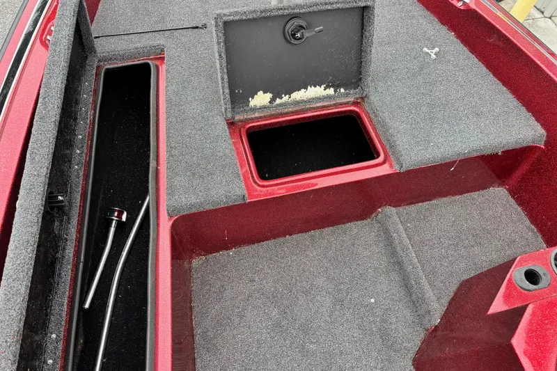 Slide: The Image of Interior of a 1995 Hydra-Sports Z260 boat showing storage compartments and carpeted flooring. - 3