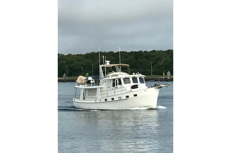 The Image of 2007 Kadey-Krogen Krogen 44' yacht cruising on calm blue waters. - 0