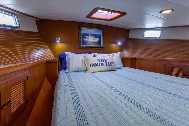 Slide: The Image of Luxurious cabin interior of 2007 Krogen 44' Widebody yacht with cozy bedding. - 14