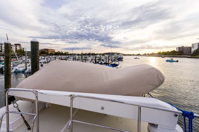 Slide: The Image of 2007 Krogen 44' Widebody yacht docked at marina during sunset. - 26