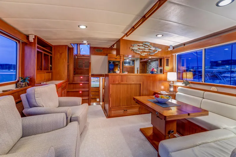 Slide: The Image of Luxurious interior of 2007 Krogen 44' Widebody yacht with elegant wood finishes and comfortable seating. - 3