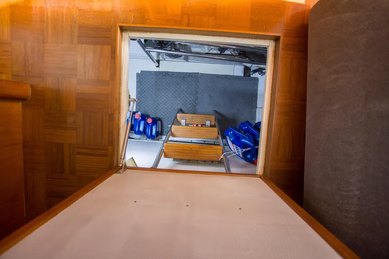 Slide: The Image of Engine room access in 2007 Krogen 44' Widebody yacht, featuring storage and equipment. - 33