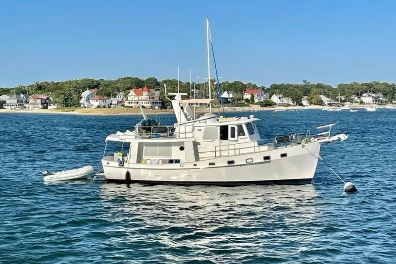 Slide: The Image of 2007 Kadey-Krogen Krogen 44' yacht anchored in scenic coastal waters. - 41