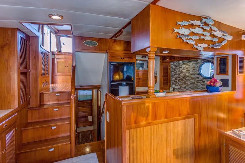 Slide: The Image of Interior of 2007 Krogen 44' Widebody yacht with wooden finishes and nautical decor. - 6