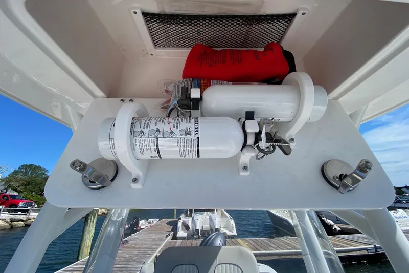 Slide: The Image of 2024 Sea Fox 228 Commander boat safety equipment storage with fire extinguisher and life jackets. - 22
