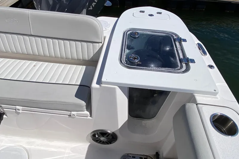 Slide: The Image of 2024 Sea Fox 228 Commander boat interior with seating and storage compartment. - 15
