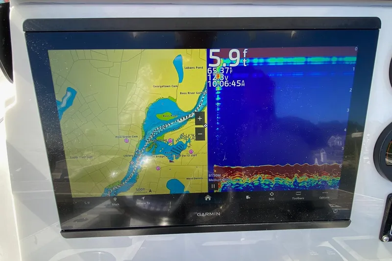 Slide: The Image of Garmin marine display on 2024 Sea Fox 228 Commander showing navigation and sonar data. - 8