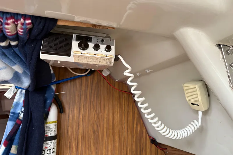 Slide: The Image of 1983 Sonic 23 interior with vintage radio and microphone setup. - 25