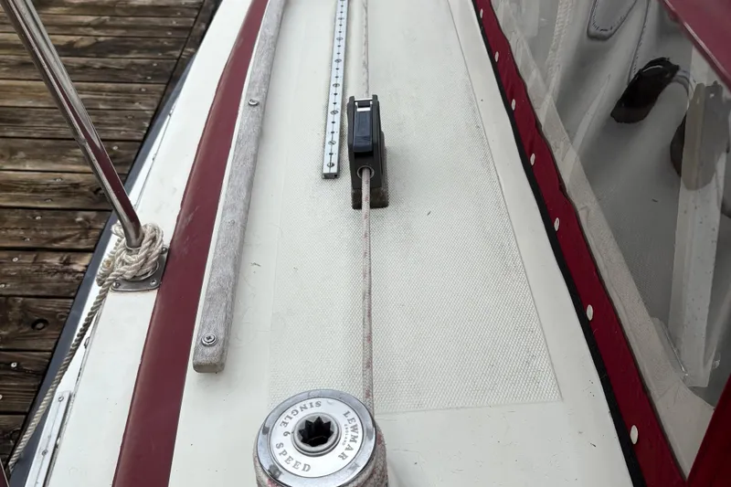 Slide: The Image of Deck of 1983 Sonic 23 sailboat with winch and rope details. - 3