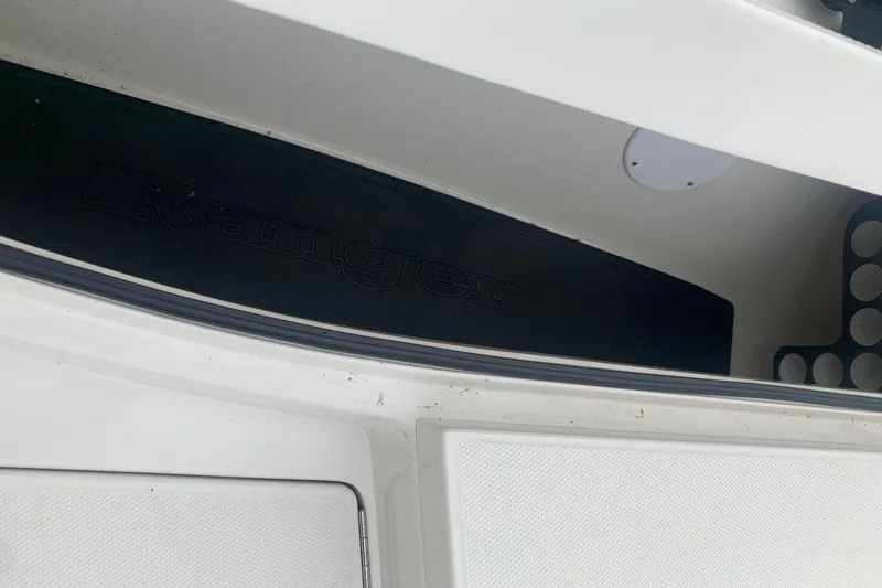 Slide: The Image of 2016 Ranger 2510 Bay Ranger boat interior detail with logo. - 12