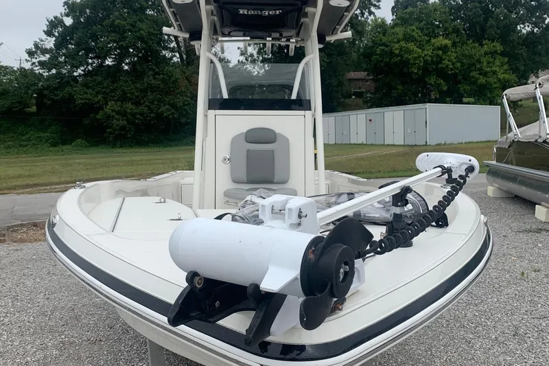 Slide: The Image of 2016 Ranger 2510 Bay Ranger boat with trolling motor, parked outdoors. - 2