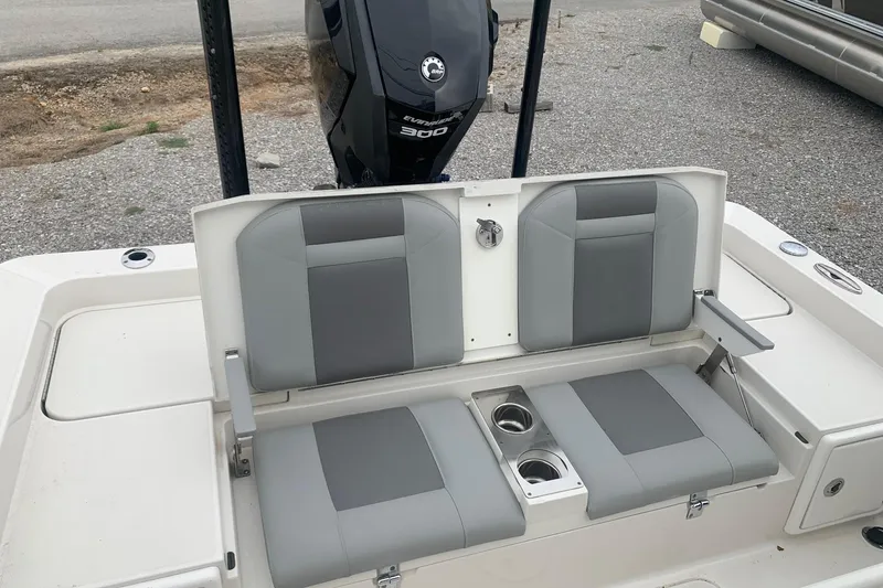 Slide: The Image of 2016 Ranger 2510 Bay Ranger boat seats with cup holders and Evinrude 300 engine. - 6