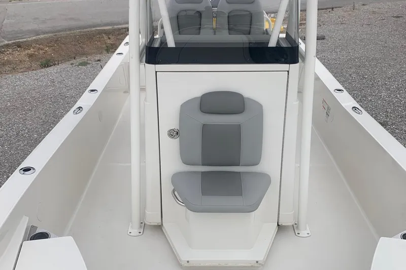 Slide: The Image of 2016 Ranger 2510 Bay Ranger boat with gray seating and center console. - 7