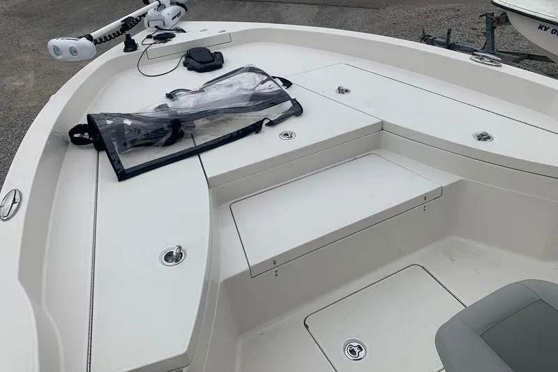 Slide: The Image of 2016 Ranger 2510 Bay Ranger boat interior with storage compartments and trolling motor. - 9