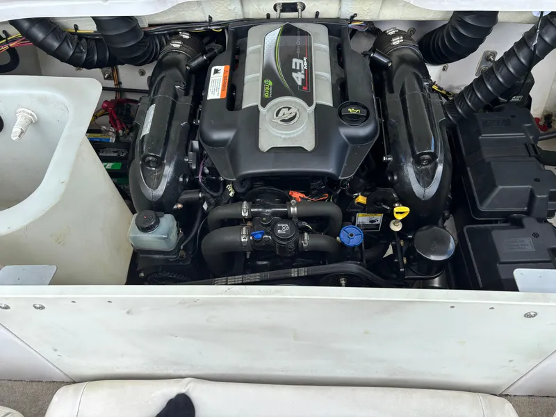 Slide: The Image of Engine compartment of a 2013 Glastron 205 MXSF boat. - 11