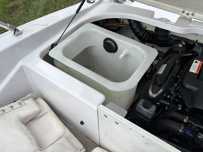 Slide: The Image of Engine compartment of a 2013 Glastron 205 MXSF boat. - 13