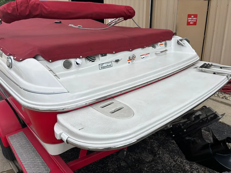 Slide: The Image of Red 2013 Glastron 205 MXSF boat with cover. - 2